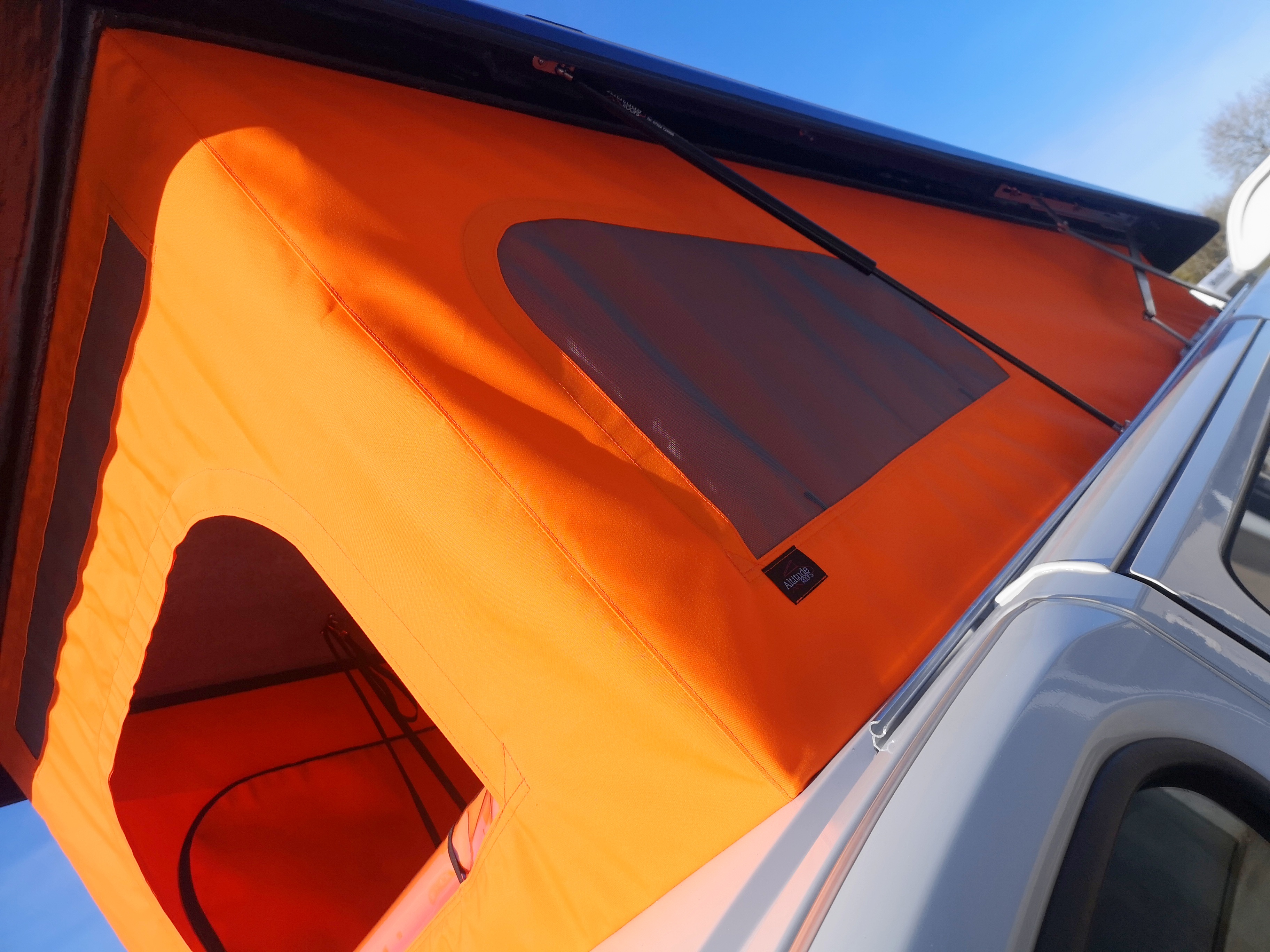 Orange elevating pop-top roof canvas